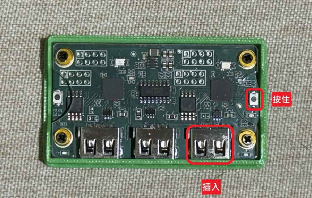 Makcu with cover removed, right button highlighted to hold, right USB port highlighted